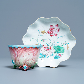 A Chinese famille rose 'lotus' cup and saucer with applied design, Yongzheng