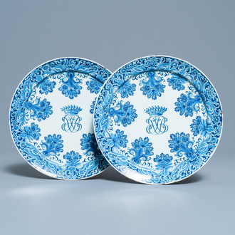 A pair of Dutch Delft blue and white plates with crowned monograms, 1st quarter 18th C.