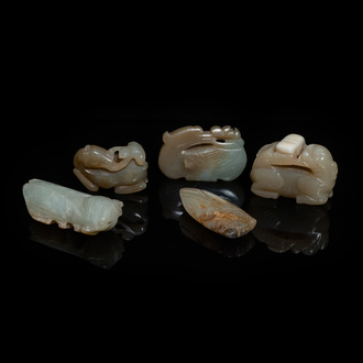 Five Chinese celadon and russet jade carvings, 19th C.