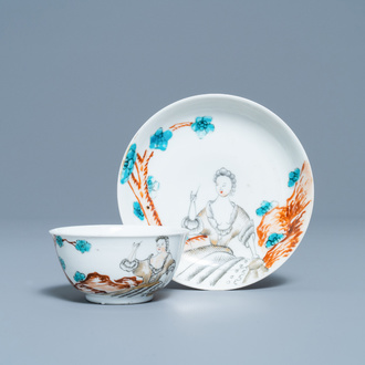 A Chinese export porcelain cup and saucer with a seamstress, Qianlong