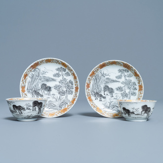 A pair of Chinese grisaille and gilt 'buffalo' cups and saucers, Yongzheng