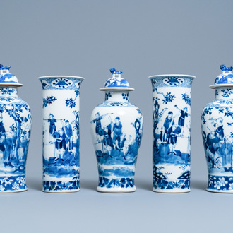 A Chinese blue and white garniture of five vases, Kangxi mark, 19th C.