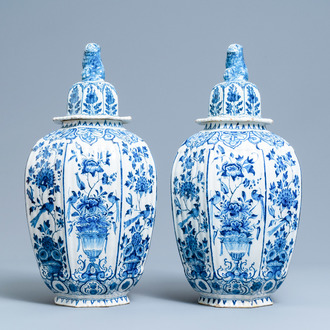 A pair of large Dutch Delft blue and white vases and covers, 18th C.