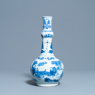 A Chinese blue and white bottle vase with figures in a landscape, Transitional period