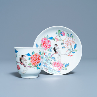 A Chinese famille rose cup and saucer with a bird on a blossoming branch, Yongzheng