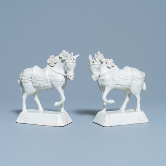 A pair of white Dutch Delftware models of horses, 18th C.