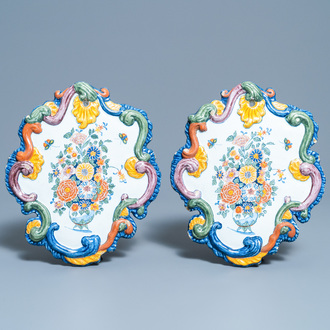 A pair of fine polychrome Dutch Delft plaques with still lifes of flowers in a vase, 18th C.