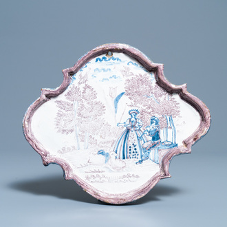 A blue and manganese Dutch Delft 'pastoral scene' plaque, 18th C.