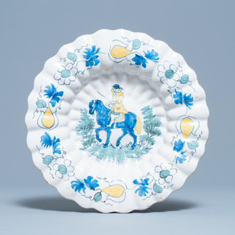 A polychrome Dutch Delft gadrooned dish with a horse rider, late 17th C.