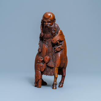 A Chinese bamboo wood carving of Shou Lao on a deer, Ming