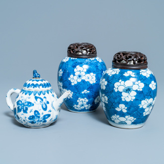 A pair of Chinese blue and white 'prunus on cracked ice' jars and a 'butterfly' teapot and cover, Kangxi