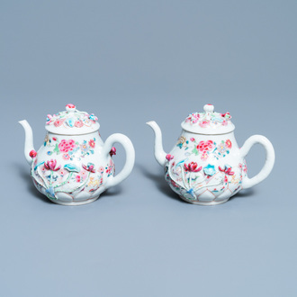 A pair of Chinese famille rose relief-decorated teapots and covers, Yongzheng