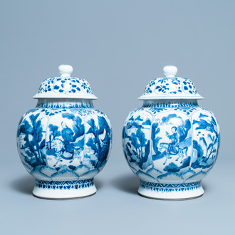 A pair of Chinese blue and white 'hunting scene' jars and covers, Kangxi