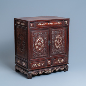 A Chinese mother-of-pearl-inlaid wooden two-door cabinet, 19th C.