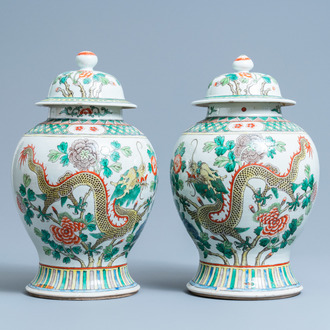 A pair of Chinese famille verte 'dragon' vases and covers, 19th C.