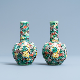 A pair of Chinese reticulated famille verte bottle vases, 19th C.