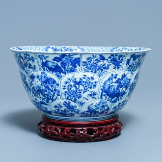 A large Chinese blue and white bowl with floral panels, Kangxi