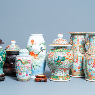 Six Chinese famille rose vases and various wooden stands and covers, 19/20th C.