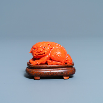 A Chinese carved red coral model of a Buddhist lion, 19/20th C.