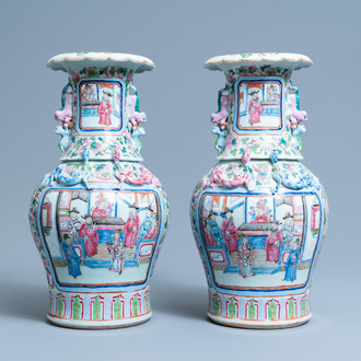 A pair of Chinese famille rose 'court scene' vases, 19th C.