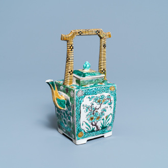 A Chinese verte biscuit teapot and cover, Kangxi