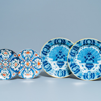 A pair of Dutch Delft blue and white dishes and a pair of polychrome plates, 18th C.