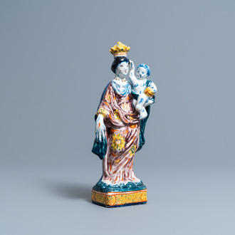 A polychrome Dutch Delft figure of the Madonna with child, 18th C.
