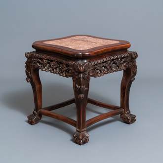 A Chinese carved wooden stand with marble top, 19th C.