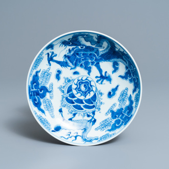 A Chinese blue and white 'dragon and qilin' dish, Yongzheng mark and of the period