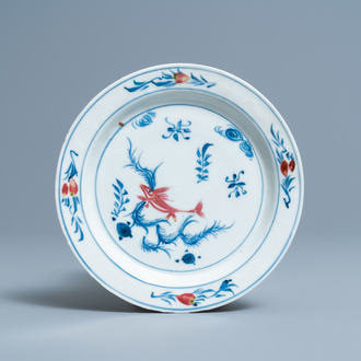 A Chinese blue, white and copper-red 'fish' plate, Wanli