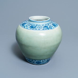 A Chinese celadon-ground and blue and white 'lotus scroll' jar, Ming