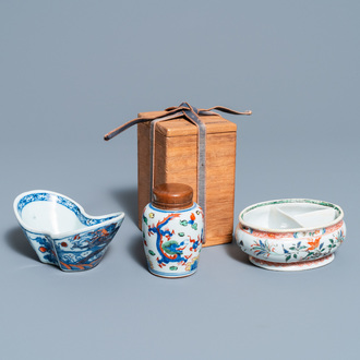 A Chinese doucai bowl, a famille verte spice box and a wucai tea caddy, Kangxi and later