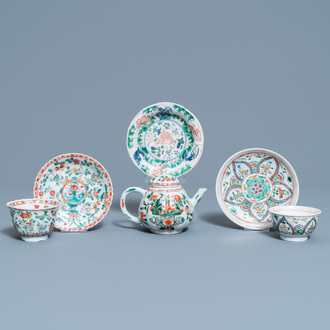 A Chinese famille verte teapot, two cups and three saucers, Kangxi