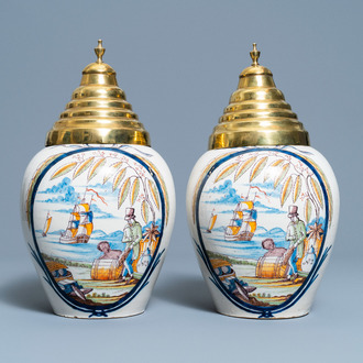 A pair of polychrome Dutch Delft tobacco jars with a merchant and a slave, late 18th C.