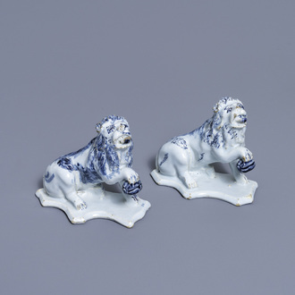 A pair of Dutch Delft blue and white models of lions, 18th C.