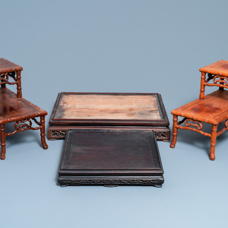 Four large Chinese carved wooden stands, 19/20th C.
