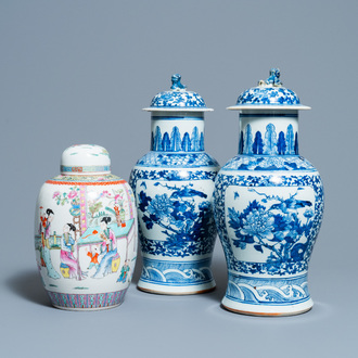 A pair of Chinese blue and white vases and a famille rose jar and cover, 19/20th C.