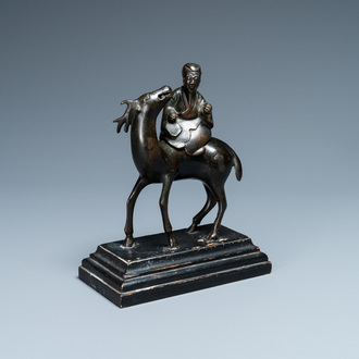 A Chinese bronze censer depicting a scholar on a deer, early Qing