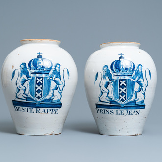 A pair of large Dutch Delft blue and white tobacco jars with the arms of Amsterdam, 18th C.