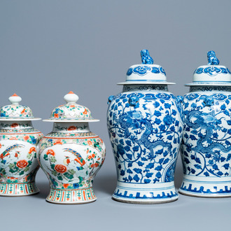 Two pairs of Chinese blue and white and famille verte vases and covers, 19/20th C.