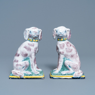 A pair of polychrome Dutch Delft money banks modelled as dogs, 18th C.