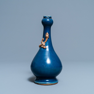 A Chinese monochrome blue garlic head vase with applied biscuit dragon, Jiajing