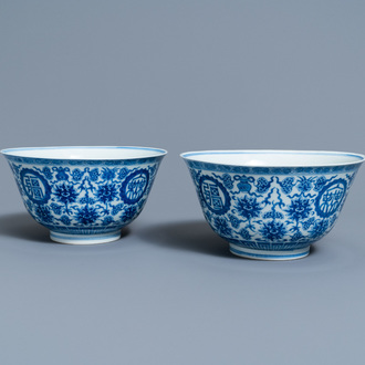 A pair of Chinese blue and white 'wan shou wu jiang' bowls, Qianlong mark and of the period