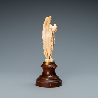 An ivory figure of a woman dressed after the antique holding a vase, probably Dieppe, France, 19th C.