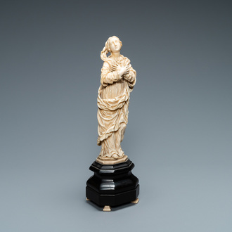 An ivory figure of a Madonna on wooden stand, Flanders or Germany, 17th C.