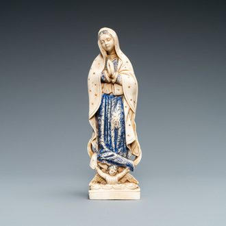 A polychromed and gilded ivory figure of a Madonna, 19th C.