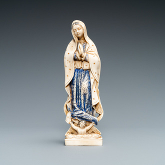 A polychromed and gilded ivory figure of a Madonna, 19th C.