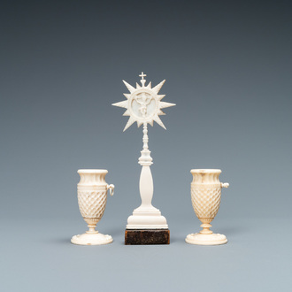 A small ivory crucifix monstrance and a pair of small bone candlesticks, Dieppe, France, 19th C.