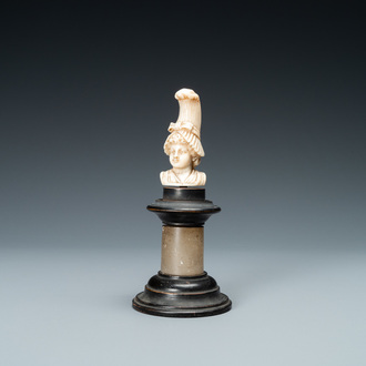 An ivory bust of a lady with a raised hairdress, 19th C.