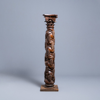 A carved walnut Ionic column with grapevines, 17th C.